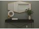Stylish entryway with a dark console table, mirror, decorative vase, and accents creating a welcoming space at 12716 Lily Quartz Loop, Parrish, FL 34219