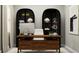 Bright home office with modern desk, décor, shelving, and neutral walls at 12716 Lily Quartz Loop, Parrish, FL 34219