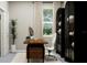 Bright home office with modern desk, décor, shelving, and large window at 12716 Lily Quartz Loop, Parrish, FL 34219