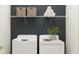 Bright laundry room with new washer and dryer plus storage shelf at 12716 Lily Quartz Loop, Parrish, FL 34219
