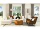 Cozy living room with modern furniture, décor, and bright natural light at 12716 Lily Quartz Loop, Parrish, FL 34219