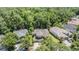 Aerial view of the home, showcasing the neighborhood and surrounding trees at 12712 Stanwyck Cir, Tampa, FL 33626