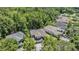 Aerial view of the home, showcasing the neighborhood and surrounding trees at 12712 Stanwyck Cir, Tampa, FL 33626
