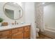 Well-lit bathroom with shiplap accent wall and modern fixtures at 12712 Stanwyck Cir, Tampa, FL 33626