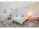 bedroom with pink accents, soft carpet and bright natural light at 12712 Stanwyck Cir, Tampa, FL 33626