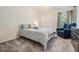 Neutral bedroom with soft carpet, accent chair and chandelier lighting at 12712 Stanwyck Cir, Tampa, FL 33626