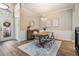 Well-lit dining area featuring a modern chandelier, wood table, and stylish decor, perfect for Gathering meals at 12712 Stanwyck Cir, Tampa, FL 33626