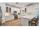 Spacious kitchen with white cabinets, stainless steel appliances, and a breakfast bar area at 12712 Stanwyck Cir, Tampa, FL 33626