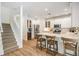 Open-concept kitchen features a large island, stainless steel appliances, and a breakfast bar at 12712 Stanwyck Cir, Tampa, FL 33626
