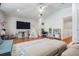 Bright living room with vaulted ceilings, hardwood floors, lots of space, and a ceiling fan at 12712 Stanwyck Cir, Tampa, FL 33626