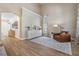 Spacious living room featuring wood flooring, high ceilings, and neutral décor, perfect for relaxation and entertaining at 12712 Stanwyck Cir, Tampa, FL 33626