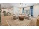 Bright and open living room with comfortable seating and views of the adjacent kitchen and dining area at 12712 Stanwyck Cir, Tampa, FL 33626