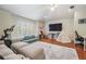 Bright and airy living room featuring hardwood floors, ample light and seating at 12712 Stanwyck Cir, Tampa, FL 33626