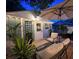 Charming backyard with a wooden deck, patio furniture, and lush potted plants, great for relaxation at 1322 Idlewild Dr, Clearwater, FL 33755