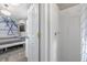 This bathroom includes a small shower area and is connected to the living space with a twin bed at 1322 Idlewild Dr, Clearwater, FL 33755