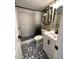 Stylish bathroom featuring modern black fixtures, patterned tile flooring, and a tiled walk-in shower at 1322 Idlewild Dr, Clearwater, FL 33755