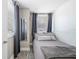 Charming bedroom featuring a mirror, window, and gray furnishings at 1322 Idlewild Dr, Clearwater, FL 33755