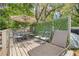 Outdoor deck with a table and chairs perfect for entertaining, plus a lounge chair for relaxing at 1322 Idlewild Dr, Clearwater, FL 33755