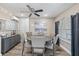 Bright dining room features a round wood table, six chairs, and large sunny window at 1322 Idlewild Dr, Clearwater, FL 33755