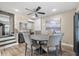 Charming dining room features a round wood table, six chairs, and tasteful decor at 1322 Idlewild Dr, Clearwater, FL 33755