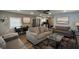 Open-concept living area featuring comfortable couches, a dining area, and a modern kitchen, great for socializing at 1322 Idlewild Dr, Clearwater, FL 33755