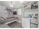 Small living space, equipped with a twin bed, tv, microwave, and mini-fridge; Perfect for efficiency at 1322 Idlewild Dr, Clearwater, FL 33755