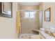 Updated bathroom features a tiled glass shower with a built-in seat at 1666 S Lake Ave # 1, Clearwater, FL 33756