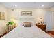 Comfortable bedroom featuring wood floors, soft lighting, and pleasant décor at 1666 S Lake Ave # 1, Clearwater, FL 33756