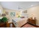 Cozy bedroom with wood floors, natural light, and comfortable furnishings at 1666 S Lake Ave # 1, Clearwater, FL 33756