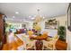 Spacious dining area featuring wood floors, a chandelier, and an open floor plan at 1666 S Lake Ave # 1, Clearwater, FL 33756