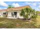 Inviting home exterior with a well-maintained lawn and a charming outdoor seating area at 1666 S Lake Ave # 1, Clearwater, FL 33756
