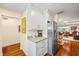 Spacious kitchen offering granite countertops, stainless steel refrigerator, and modern white cabinetry at 1666 S Lake Ave # 1, Clearwater, FL 33756