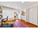 Bright laundry room featuring wood floors, washer, dryer, and ample closet space at 1666 S Lake Ave # 1, Clearwater, FL 33756