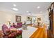 Open-concept living room features wood floors, stylish decor, and lots of natural light at 1666 S Lake Ave # 1, Clearwater, FL 33756