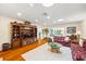 Bright living room with wood floors, custom shelves, and decorative furnishings at 1666 S Lake Ave # 1, Clearwater, FL 33756