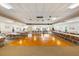 Large meeting room with rows of tables and chairs and a wood floor for dancing or activities at 1666 S Lake Ave # 1, Clearwater, FL 33756
