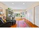 Well-lit home office with built-in shelving, ample storage, and comfortable seating area at 1666 S Lake Ave # 1, Clearwater, FL 33756