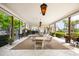 A covered patio with multiple tables and chairs offering an outdoor gathering space at 1666 S Lake Ave # 1, Clearwater, FL 33756