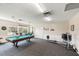 Recreation room featuring a pool table, exercise equipment, and a table with chairs at 1666 S Lake Ave # 1, Clearwater, FL 33756