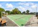 Community shuffleboard courts with green surfaces and benches on a sunny day at 1666 S Lake Ave # 1, Clearwater, FL 33756