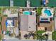 Aerial view of home with pool, new roof and expansive backyard, located near the waterfront at 17 Bellevue Dr, Treasure Island, FL 33706