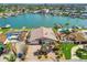 Beautiful home showing brick driveway, backyard pool, and private dock at 17 Bellevue Dr, Treasure Island, FL 33706