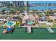Waterfront property with pool and dock, nestled in a vibrant community with palm trees and stunning bay views at 17 Bellevue Dr, Treasure Island, FL 33706