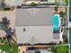 View of home with new roof with private backyard pool and access to dock at 17 Bellevue Dr, Treasure Island, FL 33706