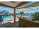 Backyard view of the pool, patio, and waterfront at 17 Bellevue Dr, Treasure Island, FL 33706