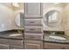 Double vanity bathroom featuring granite countertops and undermount sinks at 17 Bellevue Dr, Treasure Island, FL 33706