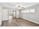Bright bedroom with wood floors, ceiling fan, and plenty of natural light at 17 Bellevue Dr, Treasure Island, FL 33706