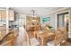 Charming dining room with wooden table, seating for eight, and open access to the kitchen at 17 Bellevue Dr, Treasure Island, FL 33706