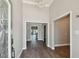 Bright foyer with wood-look tile flooring, elegant chandelier, and views into other rooms at 17 Bellevue Dr, Treasure Island, FL 33706