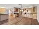 Well-designed kitchen featuring wood flooring, an island, built-in cabinets and modern appliances at 17 Bellevue Dr, Treasure Island, FL 33706
